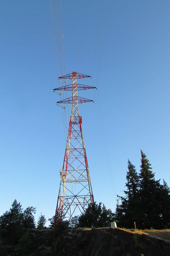 Iron Batteries Offer Cheap Storage for the Power Grid Electricity pylons at sunset